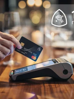 Credit card being used at a restaurant, symbolizing 15% dining rewards for 2026 savings.