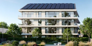 Modern eco-friendly residential building with solar panels and green landscaping