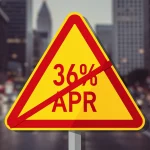 Warning sign for high APR loans in the US amid city backdrop
