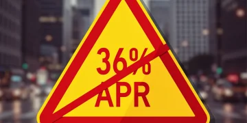 Warning sign for high APR loans in the US amid city backdrop